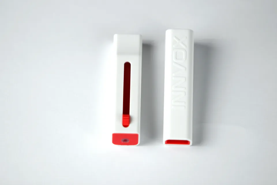 Close top view of the INNVOX red slider and whistle body.